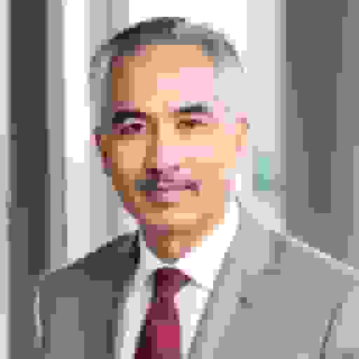 executive headshot with grey sui