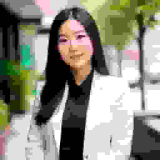 a professional ai headshot of an asian woman with white blazer